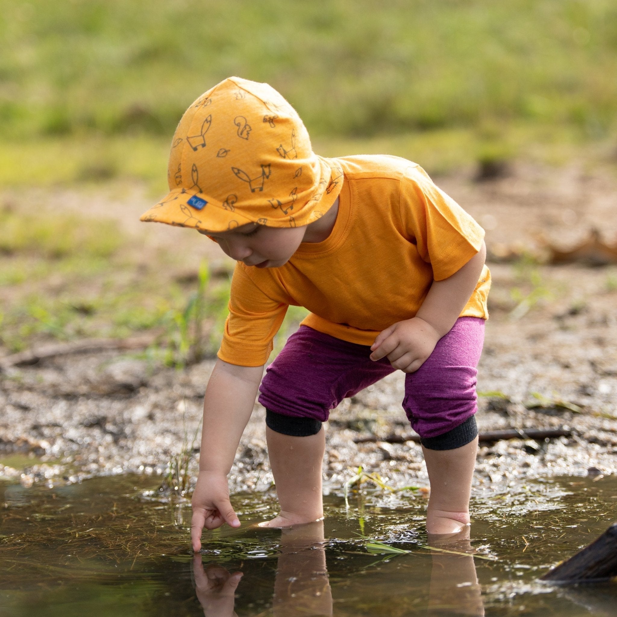 Baby mit Glückskind Sommerkappe im Sommer – die richtige Kopfbedeckung