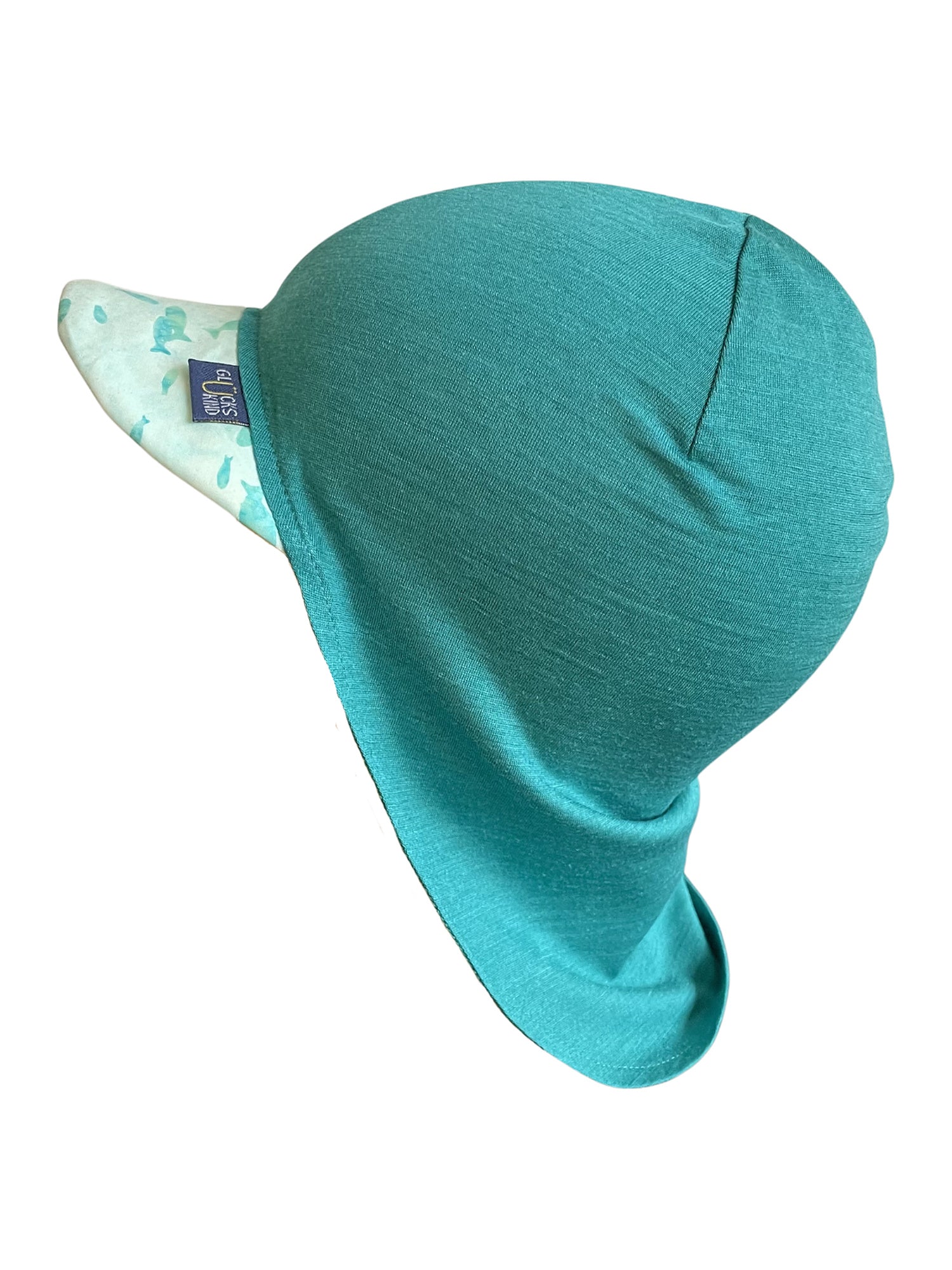 Original Glückskind Sommerkappe smaragd Fisch limited edition aus Merinowolle und Seide (bio/GOTS) - by heywool, Freisteller Seitenansicht #ay